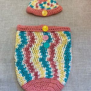 Crocheted baby hat with matching cocoon.